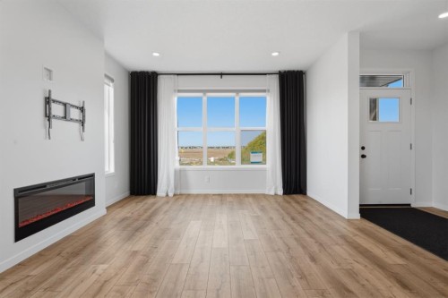 20305 45 Street Se, Calgary, AB - Indoor Photo Showing Other Room With Fireplace