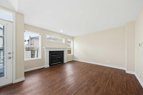 133 Saddlecrest Green Ne, Calgary, AB - Indoor Photo Showing Living Room With Fireplace