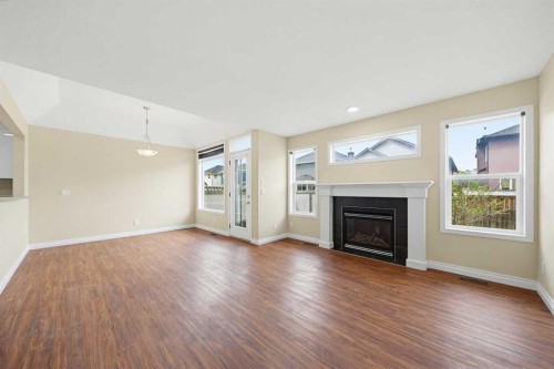 133 Saddlecrest Green Ne, Calgary, AB - Indoor Photo Showing Living Room With Fireplace