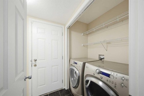 133 Saddlecrest Green Ne, Calgary, AB - Indoor Photo Showing Laundry Room