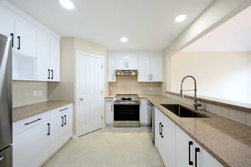 133 Saddlecrest Green Ne, Calgary, AB - Indoor Photo Showing Kitchen With Upgraded Kitchen