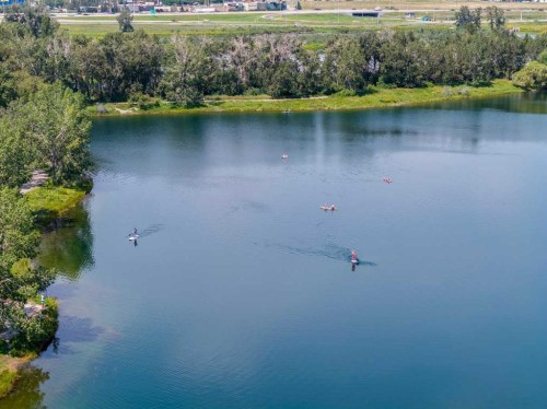 116 Riverbirch Crescent Se, Calgary, AB - Outdoor With Body Of Water With View