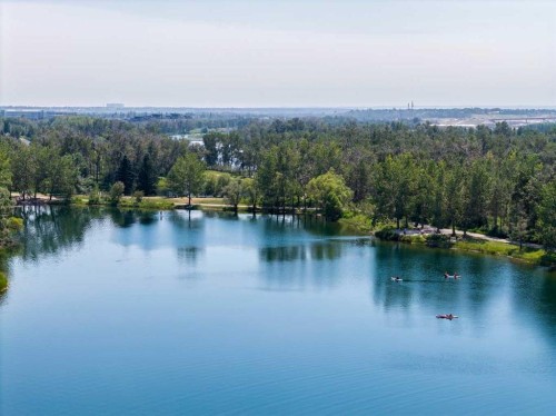 116 Riverbirch Crescent Se, Calgary, AB - Outdoor With Body Of Water With View