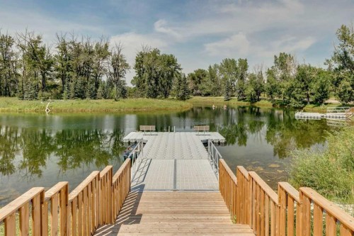 116 Riverbirch Crescent Se, Calgary, AB - Outdoor With Body Of Water With View