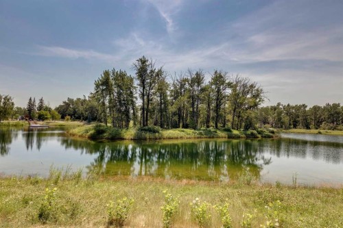 116 Riverbirch Crescent Se, Calgary, AB - Outdoor With Body Of Water With View