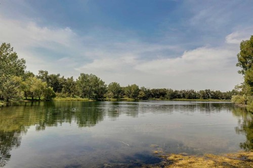 116 Riverbirch Crescent Se, Calgary, AB - Outdoor With Body Of Water With View