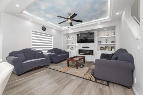 50 Saddleland Crescent Ne, Calgary, AB - Indoor Photo Showing Living Room With Fireplace