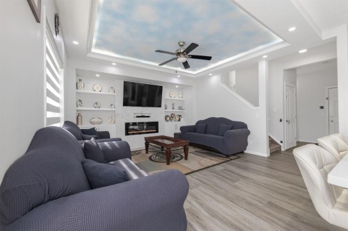 50 Saddleland Crescent Ne, Calgary, AB - Indoor Photo Showing Living Room With Fireplace