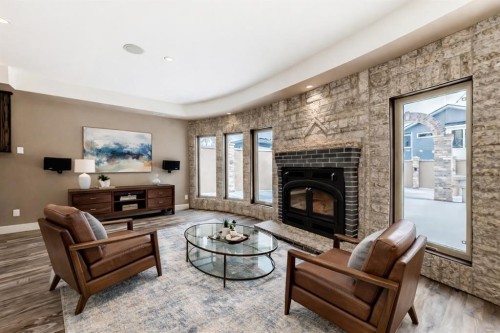 1108 Bellevue Avenue Se, Calgary, AB - Indoor Photo Showing Living Room With Fireplace