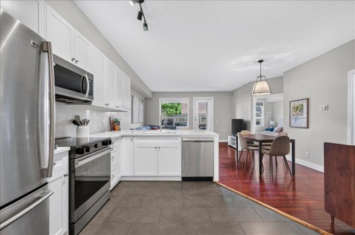 109-838 19 Avenue Sw, Calgary, AB - Indoor Photo Showing Kitchen With Double Sink