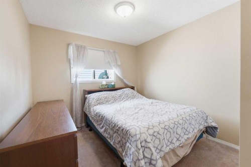 140 Arbour Stone Crescent Nw, Calgary, AB - Indoor Photo Showing Bedroom