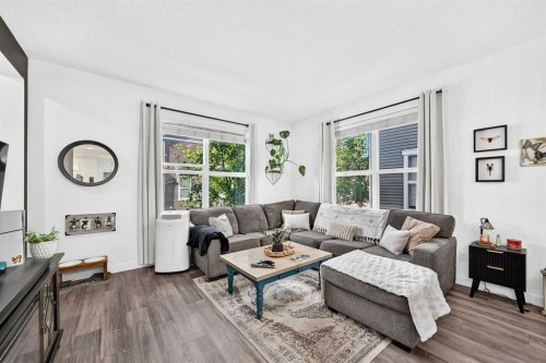 162 Silverado Boulevard Sw, Calgary, AB - Indoor Photo Showing Living Room