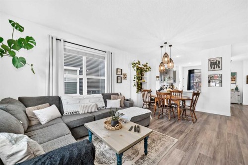 162 Silverado Boulevard Sw, Calgary, AB - Indoor Photo Showing Living Room