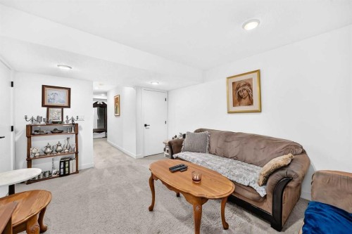 162 Silverado Boulevard Sw, Calgary, AB - Indoor Photo Showing Living Room