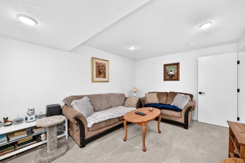 162 Silverado Boulevard Sw, Calgary, AB - Indoor Photo Showing Living Room