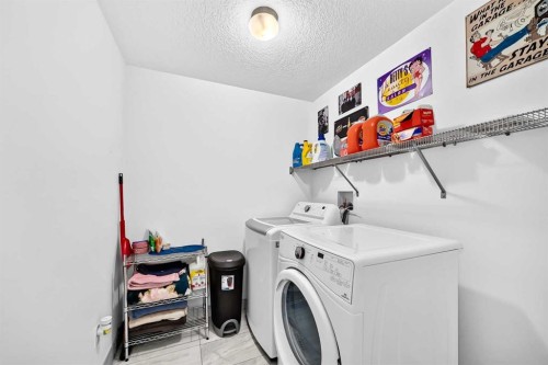 162 Silverado Boulevard Sw, Calgary, AB - Indoor Photo Showing Laundry Room