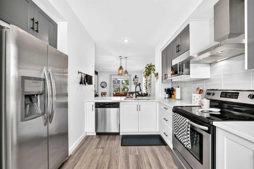 162 Silverado Boulevard Sw, Calgary, AB - Indoor Photo Showing Kitchen With Upgraded Kitchen