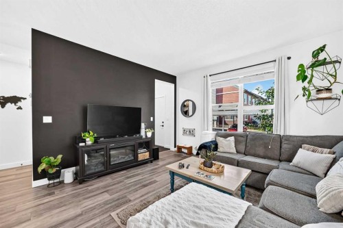 162 Silverado Boulevard Sw, Calgary, AB - Indoor Photo Showing Living Room