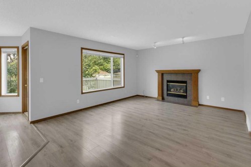 120 Gleneagles Terrace, Cochrane, AB - Indoor Photo Showing Living Room With Fireplace