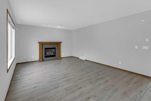 120 Gleneagles Terrace, Cochrane, AB - Indoor Photo Showing Living Room With Fireplace