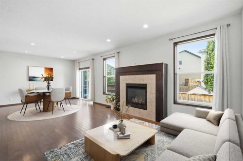 691 Panamount Boulevard Nw, Calgary, AB - Indoor Photo Showing Living Room With Fireplace