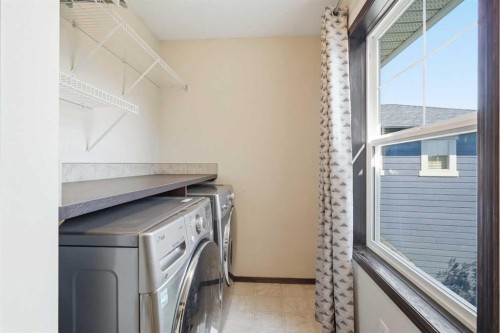 691 Panamount Boulevard Nw, Calgary, AB - Indoor Photo Showing Laundry Room