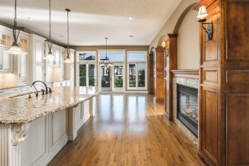 41 Cranleigh Park Se, Calgary, AB - Indoor Photo Showing Kitchen With Fireplace