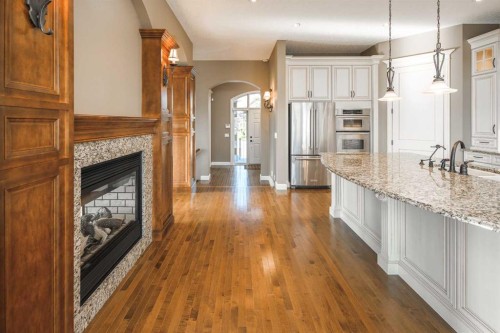 41 Cranleigh Park Se, Calgary, AB - Indoor Photo Showing Kitchen With Fireplace With Upgraded Kitchen
