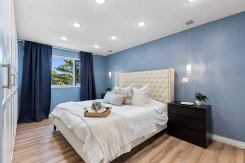8 Midridge Bay Se, Calgary, AB - Indoor Photo Showing Bedroom
