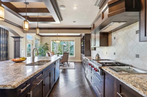 109 Aspen Ridge Place Sw, Calgary, AB - Indoor Photo Showing Kitchen With Double Sink With Upgraded Kitchen