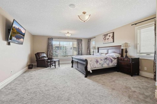 109 Aspen Ridge Place Sw, Calgary, AB - Indoor Photo Showing Bedroom