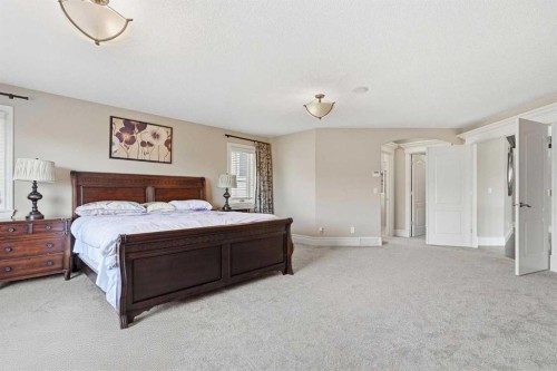 109 Aspen Ridge Place Sw, Calgary, AB - Indoor Photo Showing Bedroom