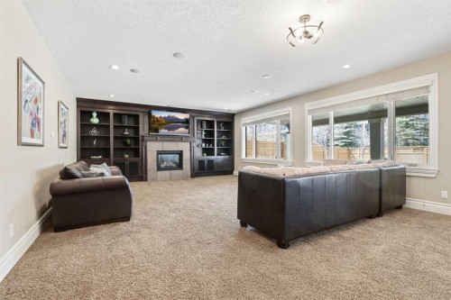 109 Aspen Ridge Place Sw, Calgary, AB - Indoor With Fireplace
