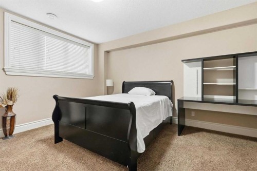 109 Aspen Ridge Place Sw, Calgary, AB - Indoor Photo Showing Bedroom