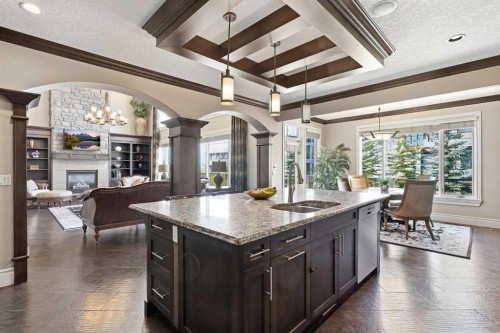 109 Aspen Ridge Place Sw, Calgary, AB - Indoor Photo Showing Kitchen With Fireplace