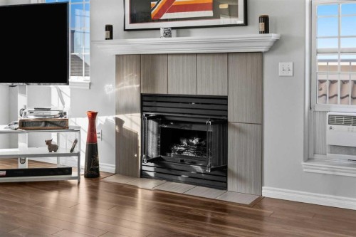 501 Patterson View Sw, Calgary, AB - Indoor Photo Showing Living Room With Fireplace