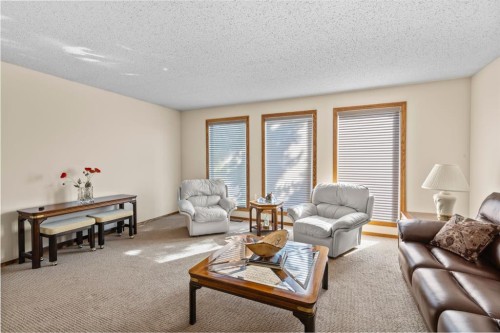 203 Silver Valley Boulevard Nw, Calgary, AB - Indoor Photo Showing Living Room