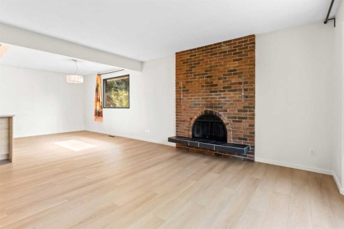 5467 Dalrymple Crescent Nw, Calgary, AB - Indoor Photo Showing Living Room With Fireplace