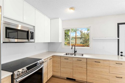 5467 Dalrymple Crescent Nw, Calgary, AB - Indoor Photo Showing Kitchen With Double Sink