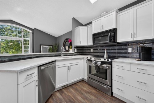 79 Cranberry Square Se, Calgary, AB - Indoor Photo Showing Kitchen With Upgraded Kitchen
