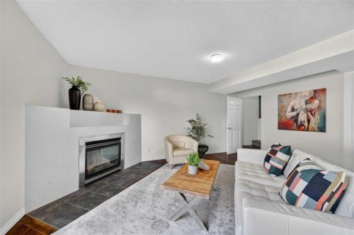 307 Covehaven View Ne, Calgary, AB - Indoor Photo Showing Living Room With Fireplace