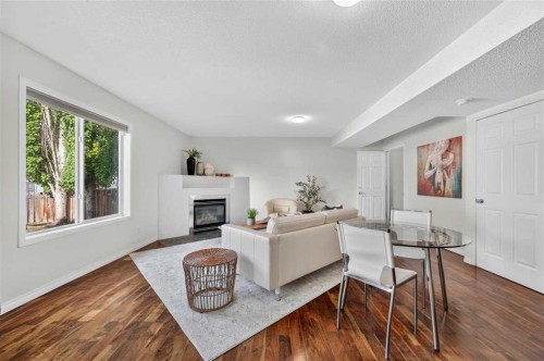 307 Covehaven View Ne, Calgary, AB - Indoor Photo Showing Living Room With Fireplace