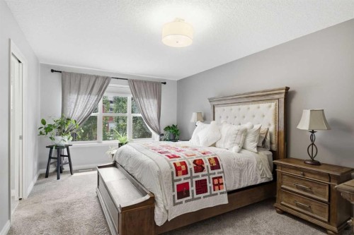 81 Riviera View, Cochrane, AB - Indoor Photo Showing Bedroom