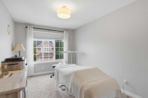81 Riviera View, Cochrane, AB - Indoor Photo Showing Bedroom