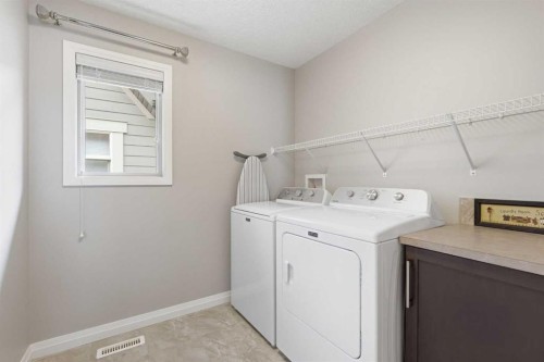 81 Riviera View, Cochrane, AB - Indoor Photo Showing Laundry Room
