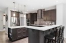 81 Riviera View, Cochrane, AB  - Indoor Photo Showing Kitchen With Stainless Steel Kitchen With Upgraded Kitchen 