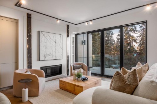 1-2703 Erlton Street Sw, Calgary, AB - Indoor Photo Showing Living Room With Fireplace