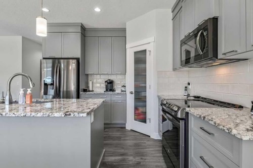 267 Cimarron Vista Court, Okotoks, AB - Indoor Photo Showing Kitchen With Upgraded Kitchen