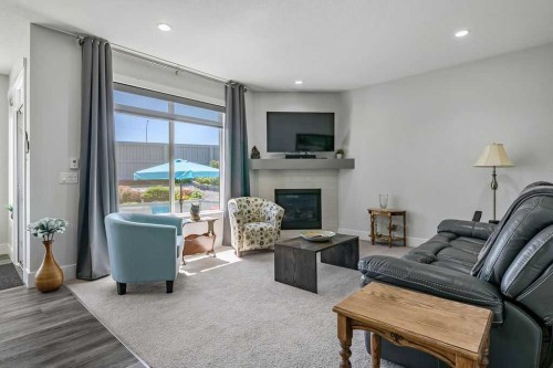 267 Cimarron Vista Court, Okotoks, AB - Indoor Photo Showing Living Room With Fireplace