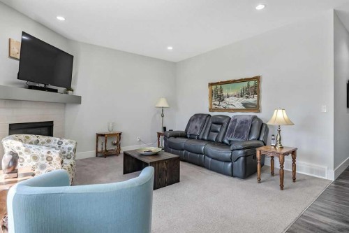 267 Cimarron Vista Court, Okotoks, AB - Indoor Photo Showing Living Room With Fireplace